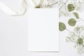 Styled stock photo. Feminine wedding desktop stationery mockup with blank greeting card, baby`s breath Gypsophila