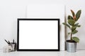 Styled tabletop, empty frame, painting art poster interior mock- Royalty Free Stock Photo