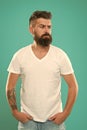 Styling beard supplies. Beard fashion and barber concept. Man bearded hipster stylish beard turquoise background. Barber