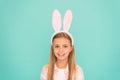 Styling in her Sundays best. Cute little girl wearing bunny ears headband. Small girl child in easter bunny style