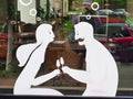 Stylised Couple Holding Wine Glasses, Bucharest cafe Window, Romania