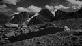 Stylised in an old archived style footage view of mountains with glaciers. 4K video with noise and scratches effects