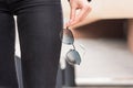 A stylish accessory. Close-up of sunglasses in a woman`s hand. Outdoor portrait Royalty Free Stock Photo