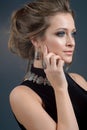 Stylish accessory on woman. Necklace with choker on neck and ear Royalty Free Stock Photo