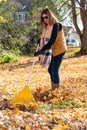 People raking leaves in fall