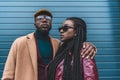 stylish african american couple in fashionable clothes posing