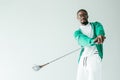 stylish african american man in retro sportswear playing golf Royalty Free Stock Photo