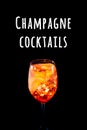 Stylish alcoholic aperol spritz cocktail with orange slice on black background.. Champagne cocktails wording