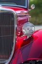 Stylish American hot rod in candy apple red, front view details Royalty Free Stock Photo