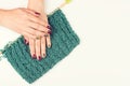 Stylish art manicure. Hand and nail care. Women hands with trendy color manicure on knitted texture. Top view, copy space. Nail Royalty Free Stock Photo