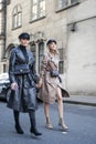 Stylish attendees gathering outside 180 The Strand for London Fashion Week