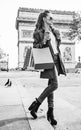 Woman shopper near Arc de Triomphe having coffee and macaroon Royalty Free Stock Photo