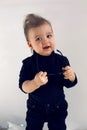 Stylish baby boy in black rocker clothes and sunglasses Royalty Free Stock Photo