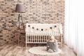 Stylish baby room interior with crib