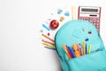 Stylish backpack with different school stationery on background, top view Royalty Free Stock Photo