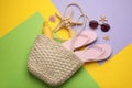 Stylish bag with beach accessories on color background, flat lay Royalty Free Stock Photo