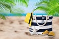 Stylish bag with accessories on tropical sandy beach, space for text Royalty Free Stock Photo