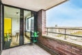 Stylish balcony with brick walls