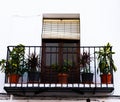 Stylish balcony with a metal railing, solid architectural element, a place of rest and relaxation, vintage decor Royalty Free Stock Photo