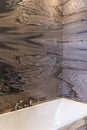 Stylish bathroom interior with marble walls. Expensive design and renovation. Vertical Royalty Free Stock Photo