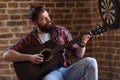 Stylish bearded musician Royalty Free Stock Photo