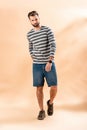 Stylish bearded young man posing in striped sweatshirt Royalty Free Stock Photo