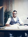 Stylish Bearded Young Man Wearing Glasses White Shirt Waistcoat Working Modern Loft Startup.Creative Guy Using Desktop Royalty Free Stock Photo