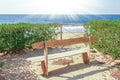 Stylish beautiful bench on nature near the sea background Royalty Free Stock Photo