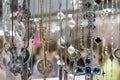 Stylish beautiful bijouterie hanging on the stand in the accessories store. Various Jewelry bijouterie show in retail shop window Royalty Free Stock Photo