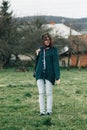 stylish beautiful brunette girl walking with photocamera and smilling outdoors in spring.portrait Royalty Free Stock Photo