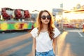 Stylish beautiful girl in fashionable clothes at sunset. Royalty Free Stock Photo