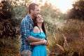 Stylish beautiful young couple standing outdoors at sunset light Royalty Free Stock Photo