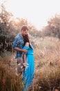 Stylish beautiful young couple standing outdoors at sunset light Royalty Free Stock Photo