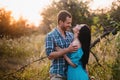 Stylish beautiful young couple standing outdoors at sunset light Royalty Free Stock Photo