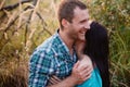 Stylish beautiful young couple standing outdoors at sunset light Royalty Free Stock Photo