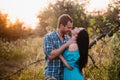 Stylish beautiful young couple standing outdoors at sunset light Royalty Free Stock Photo