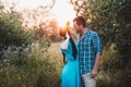 Stylish beautiful young couple standing outdoors at sunset light Royalty Free Stock Photo