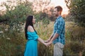 Stylish beautiful young couple standing outdoors at sunset light Royalty Free Stock Photo