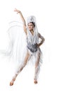 Beautiful young woman in carnival, stylish masquerade costume with feathers dancing on white studio background. Concept Royalty Free Stock Photo