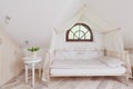 Stylish bed in romantic bedroom