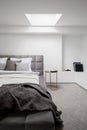 Stylish bedroom with gray quilted bed Royalty Free Stock Photo