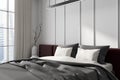 Stylish bedroom interior with bed and decoration, panoramic window Royalty Free Stock Photo