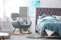Stylish bedroom interior with armchair Royalty Free Stock Photo