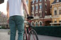 Stylish biker with vintage race bike