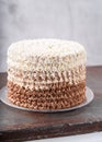 Stylish Birthday buttercream cake with with piping decoration. Vertical composition, copy space. Sweet delicious food dessert