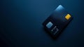 Sleek black credit card on a dark blue background, minimalist financial concept. stylish modern banking. security and