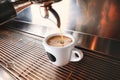 Stylish black espresso making machine brewing two cups of coffee, shooted in cafe. Royalty Free Stock Photo