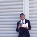 Stylish black man documents handling Royalty Free Stock Photo