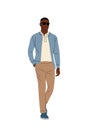 Stylish black man walking in smart casual outfit. Royalty Free Stock Photo