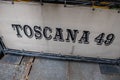 Stylish black sign with the words "Toscana 49" written in an elegant font in New York, United States